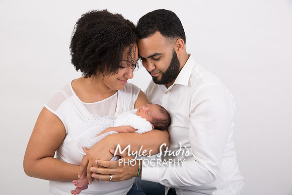 Studio Family Portrait with a newborn baby girl.