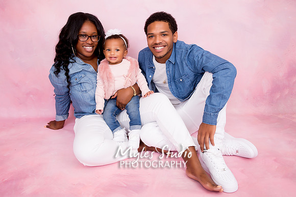 Studio Family Portrait with mom, dad,a and baby girl.